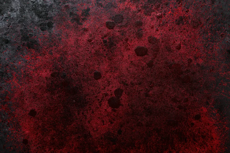 Abstract red and black grunge texture on rough concrete or metal surface
