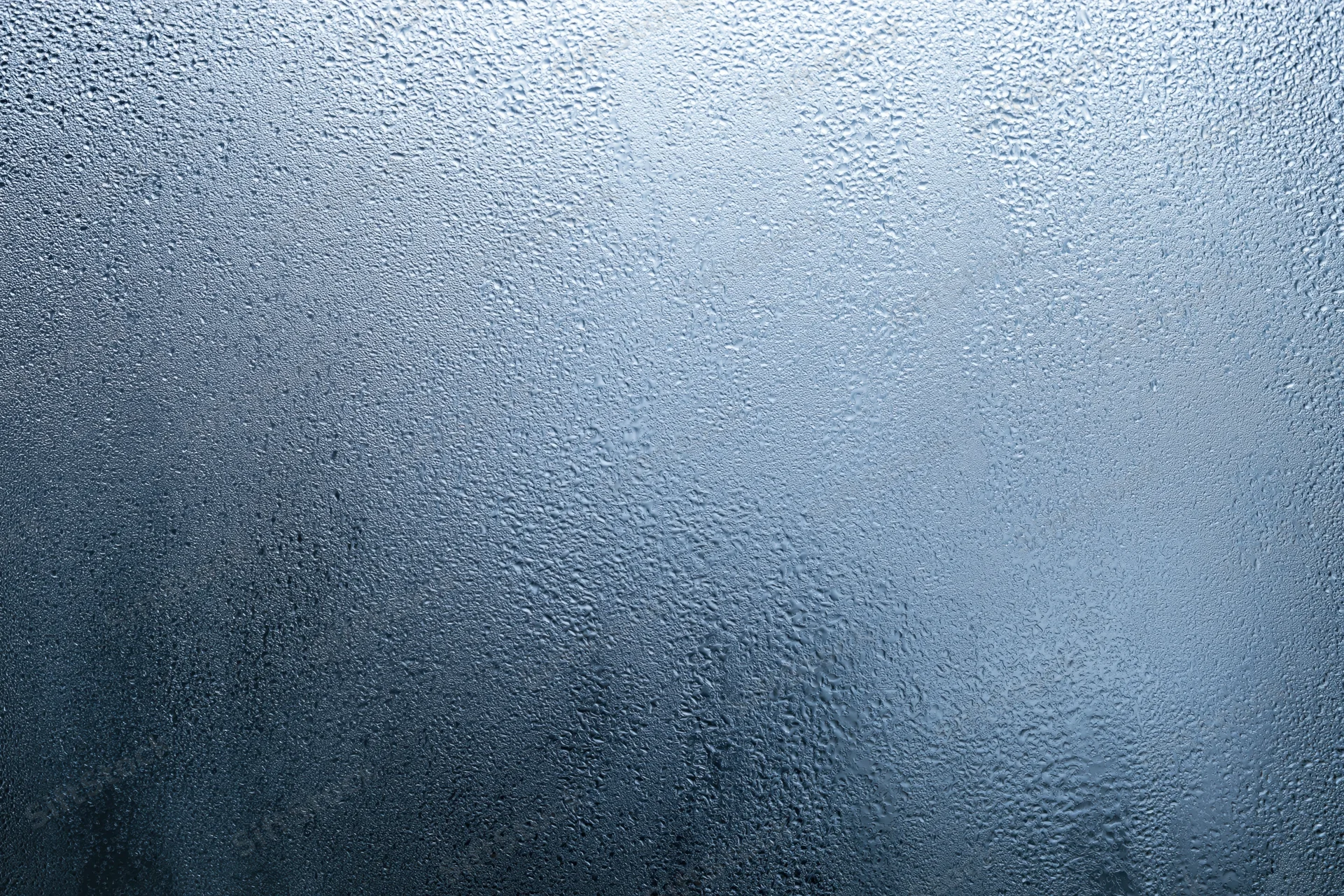 Close-up of water condensation on a fogged glass surface