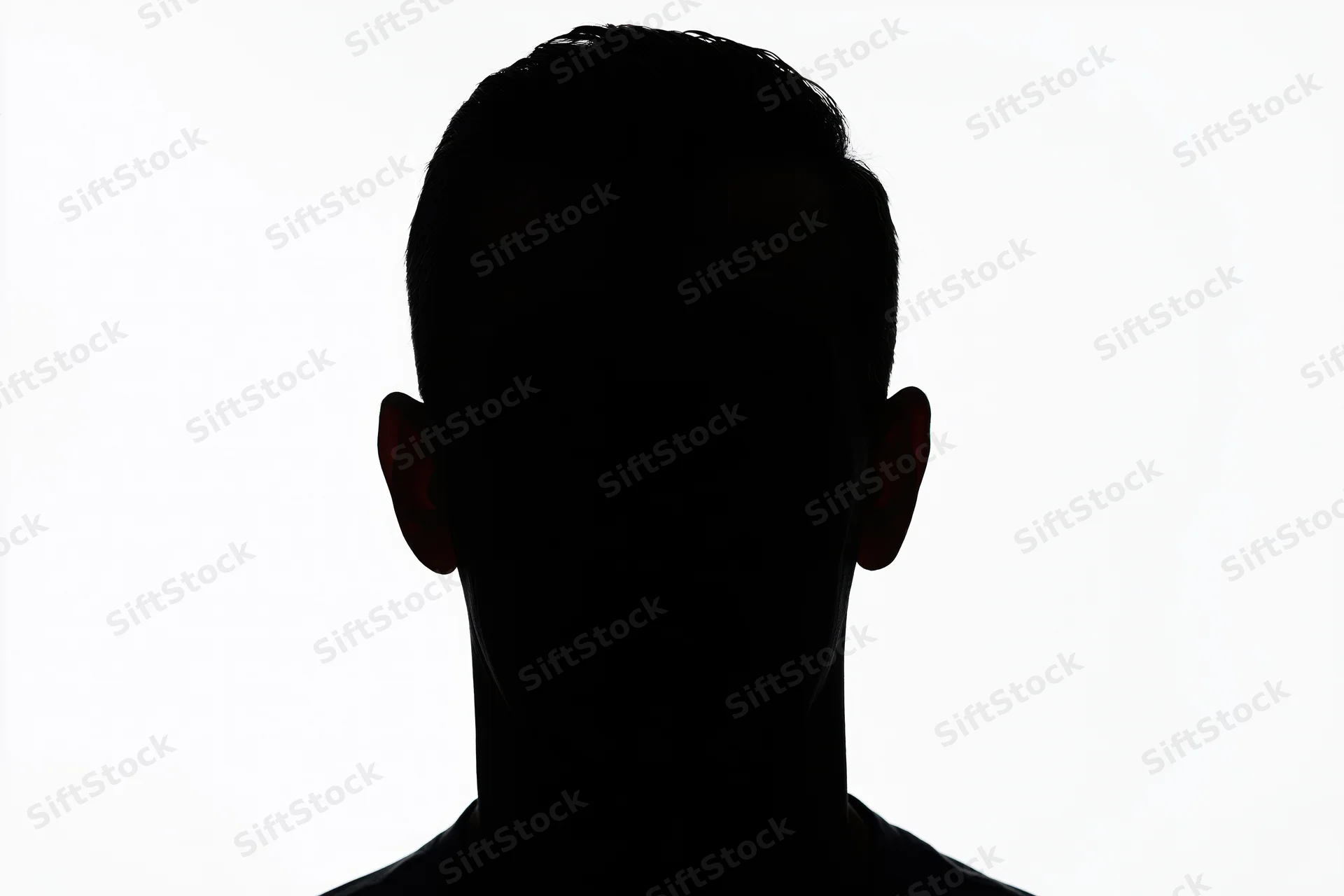 Silhouette of a man's head and shoulders facing forward against white background