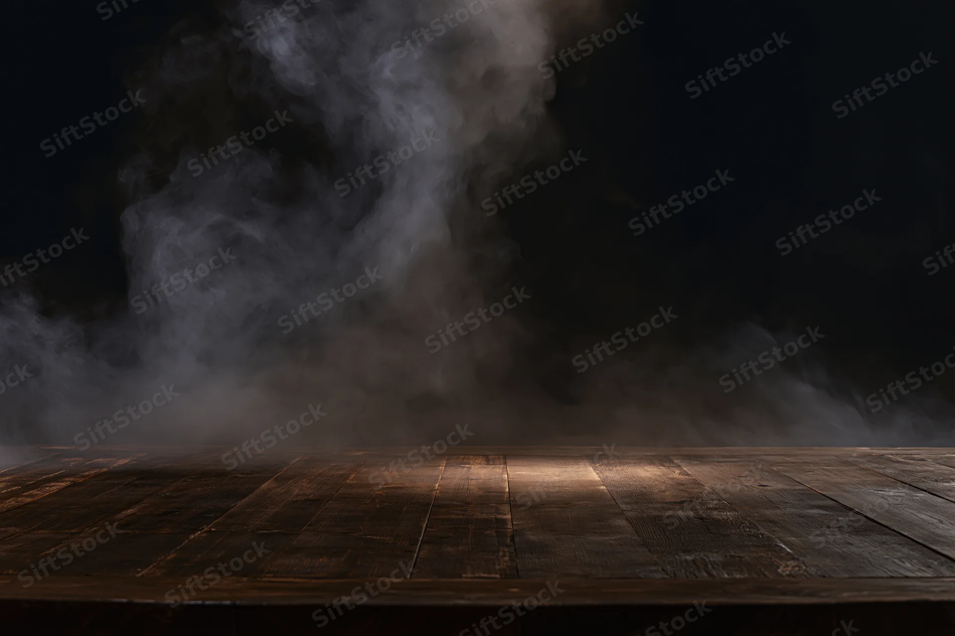 Dark wooden table surface with rising smoke in a dim studio setting