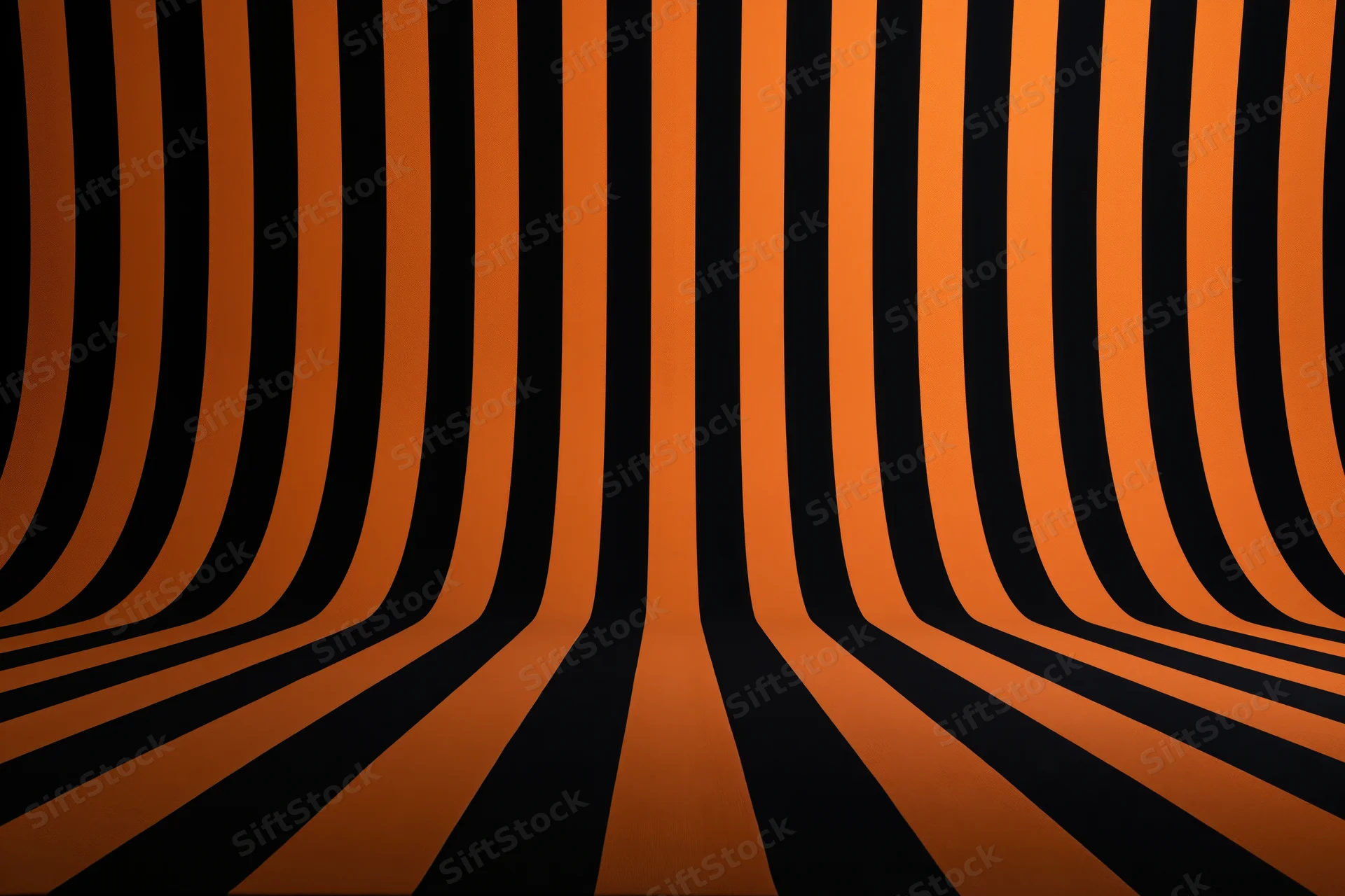 Curved orange and black stripes creating an infinite tunnel effect in a studio backdrop