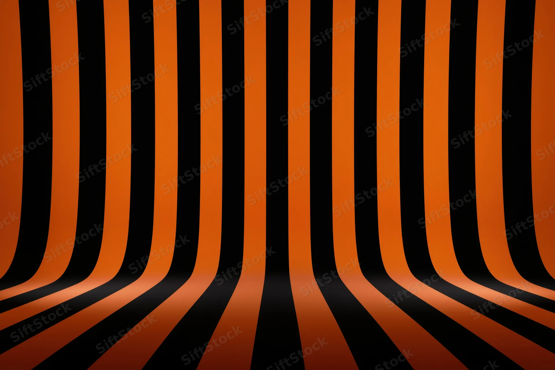 Curved orange and black stripes creating an infinite tunnel perspective in a studio backdrop