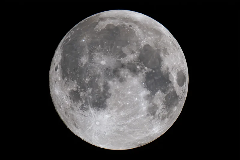 Full moon filling the frame against a black sky