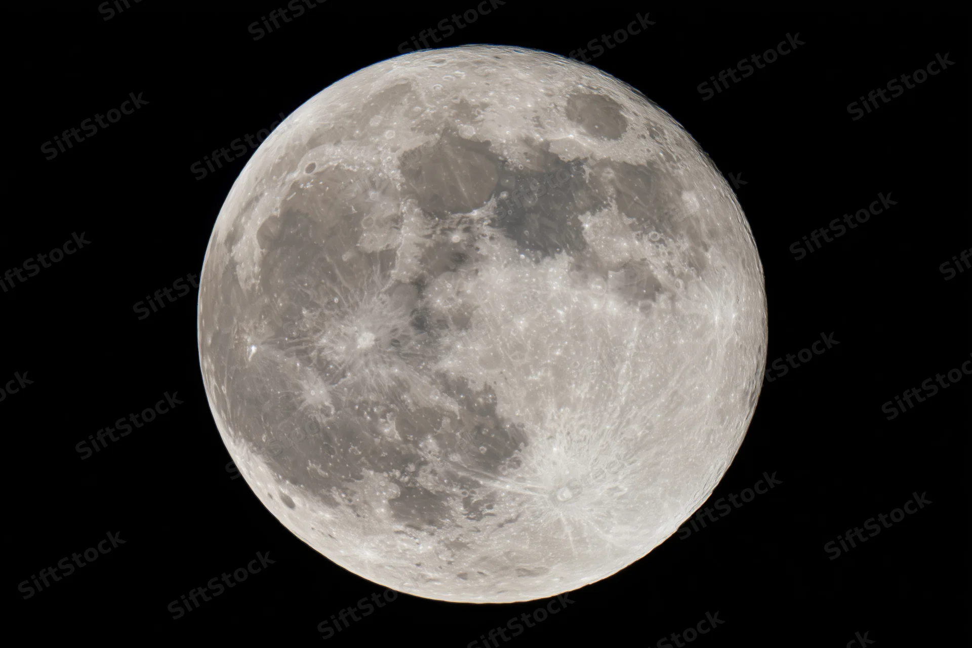 Full moon filling the frame against a black sky, detailed surface with craters and maria visible