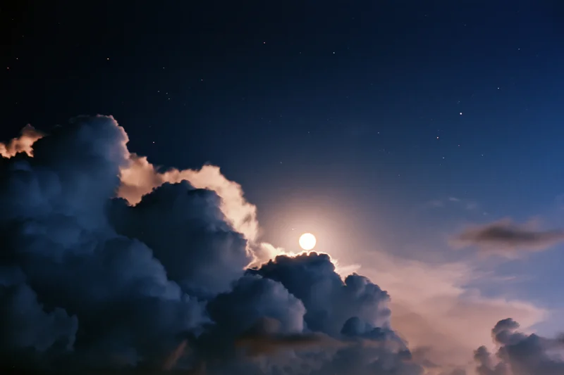 Full moon rising above dense dark storm clouds in night sky