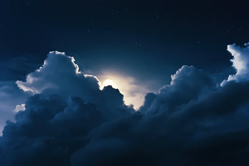 Full moon rising above dense dark storm clouds in night sky