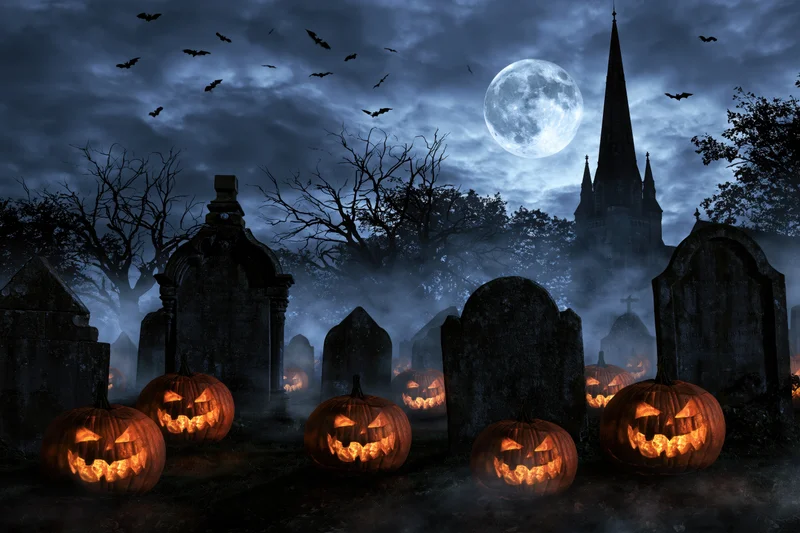 Carved jack-o-lanterns glowing among tombstones in a foggy graveyard at night under a full moon with bats flying and a church spire in the background