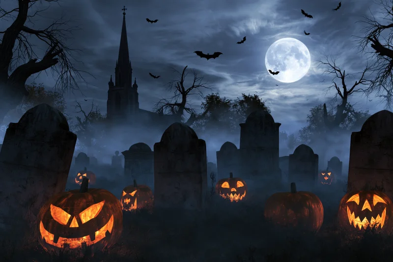 Carved jack-o-lanterns glowing in a foggy graveyard at night with a full moon and bats flying over a church