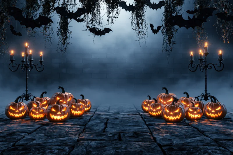 Carved jack-o-lanterns glowing on stone floor with candelabras and hanging bats against a foggy brick wall