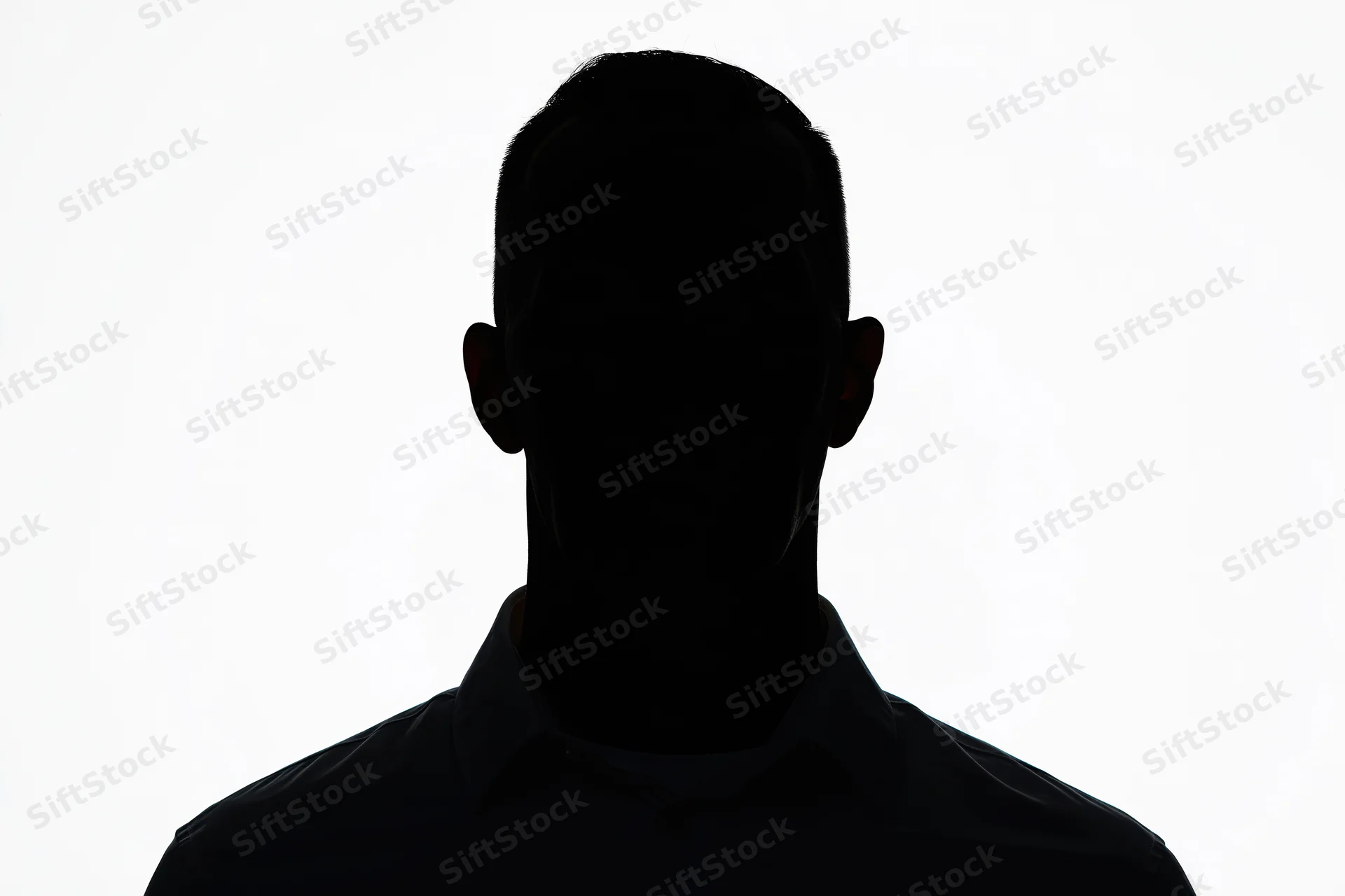 Silhouette of a man facing forward in a collared shirt against white background
