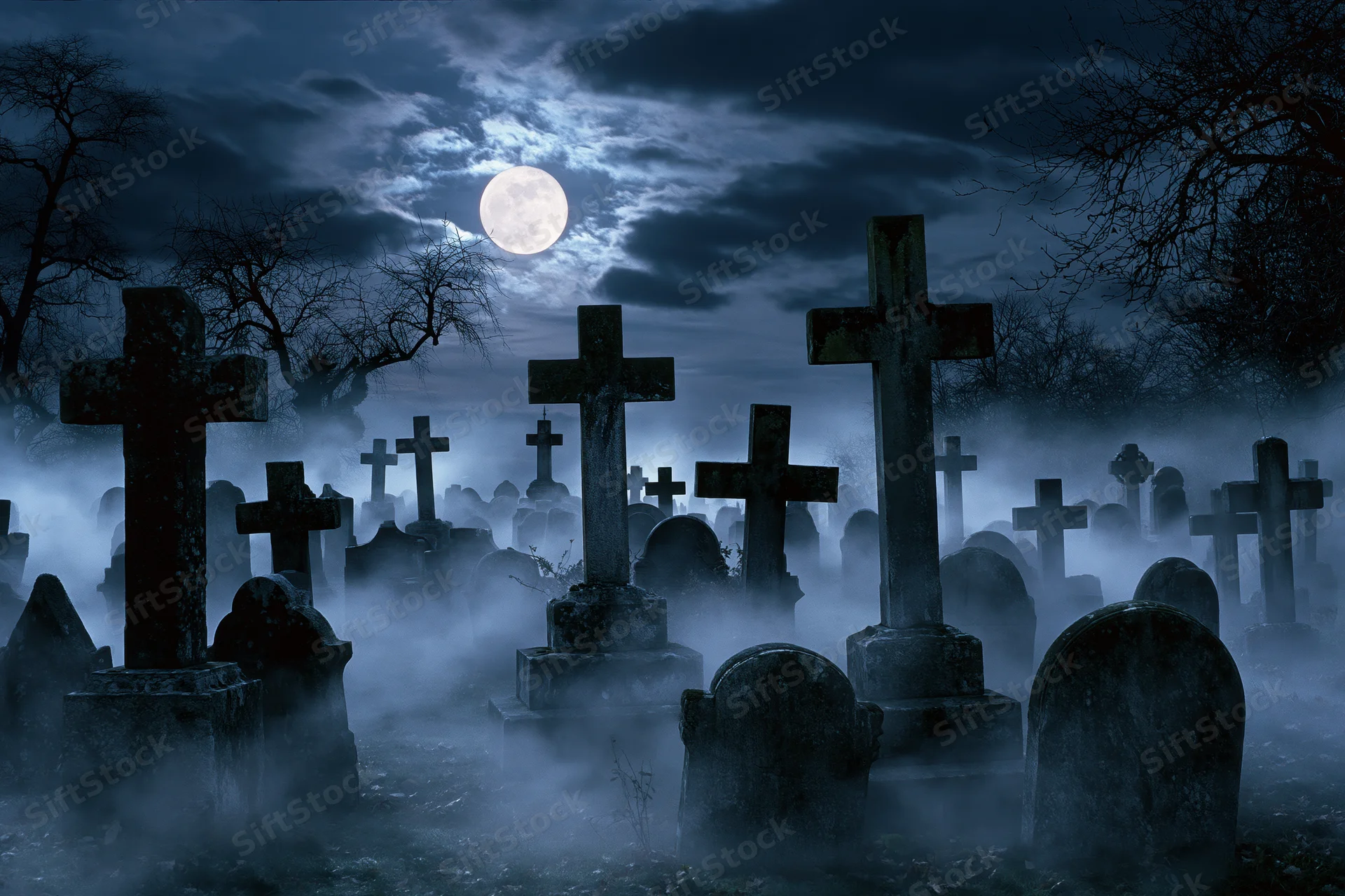 Old cemetery at night with weathered stone crosses and tombstones in fog under full moon