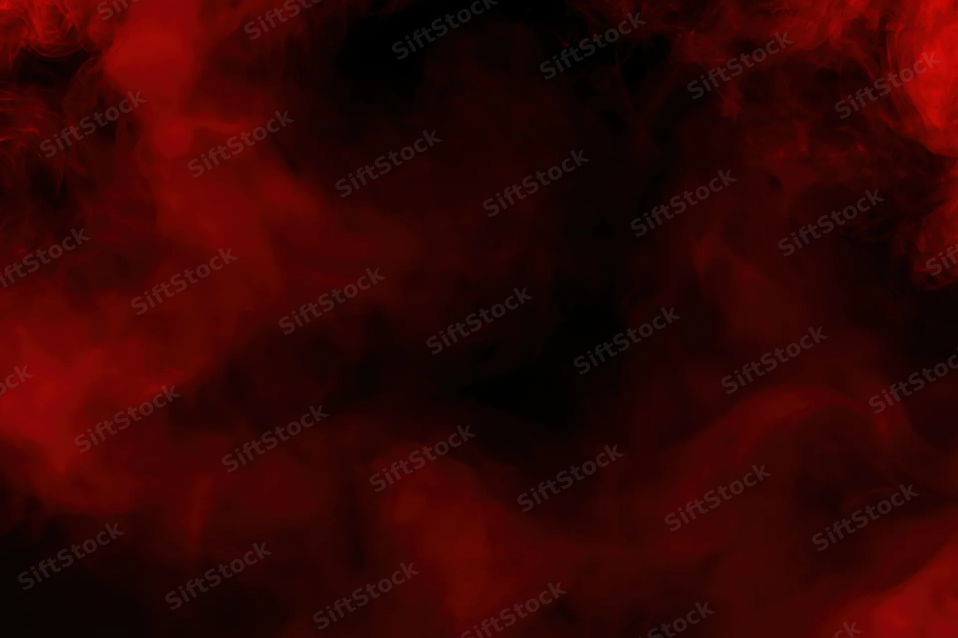 Swirling red smoke drifting in dark clouds filling the frame