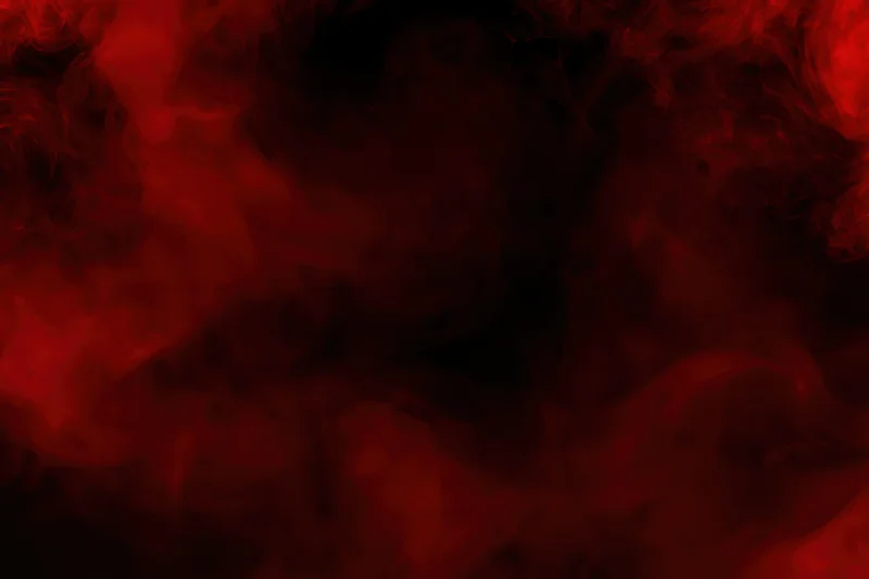 Swirling red smoke drifting in dark clouds filling the frame