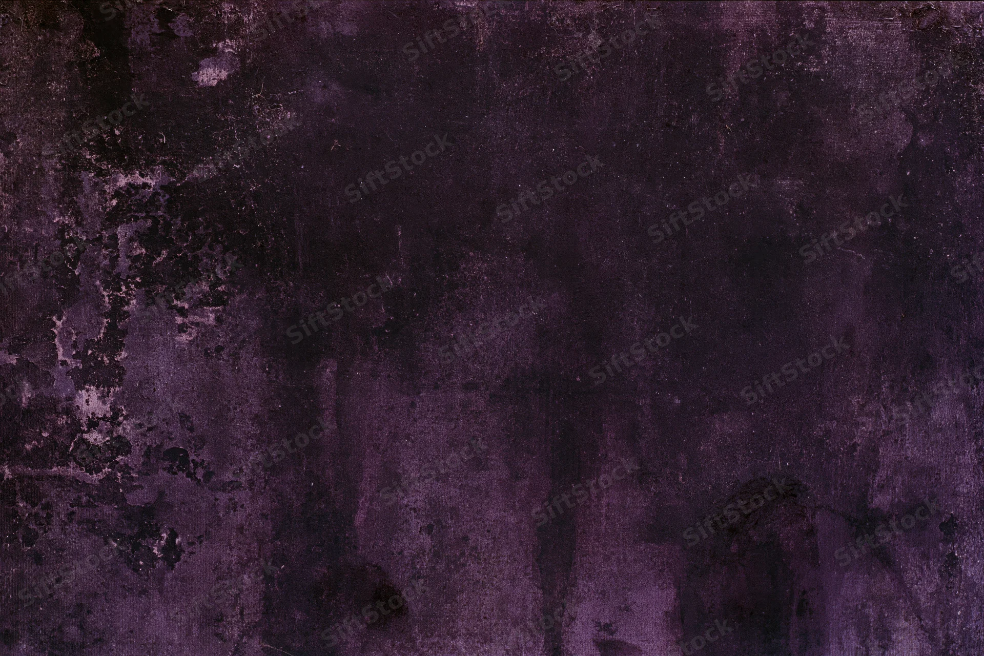 Weathered concrete wall surface filling the frame with dark purple and black tones