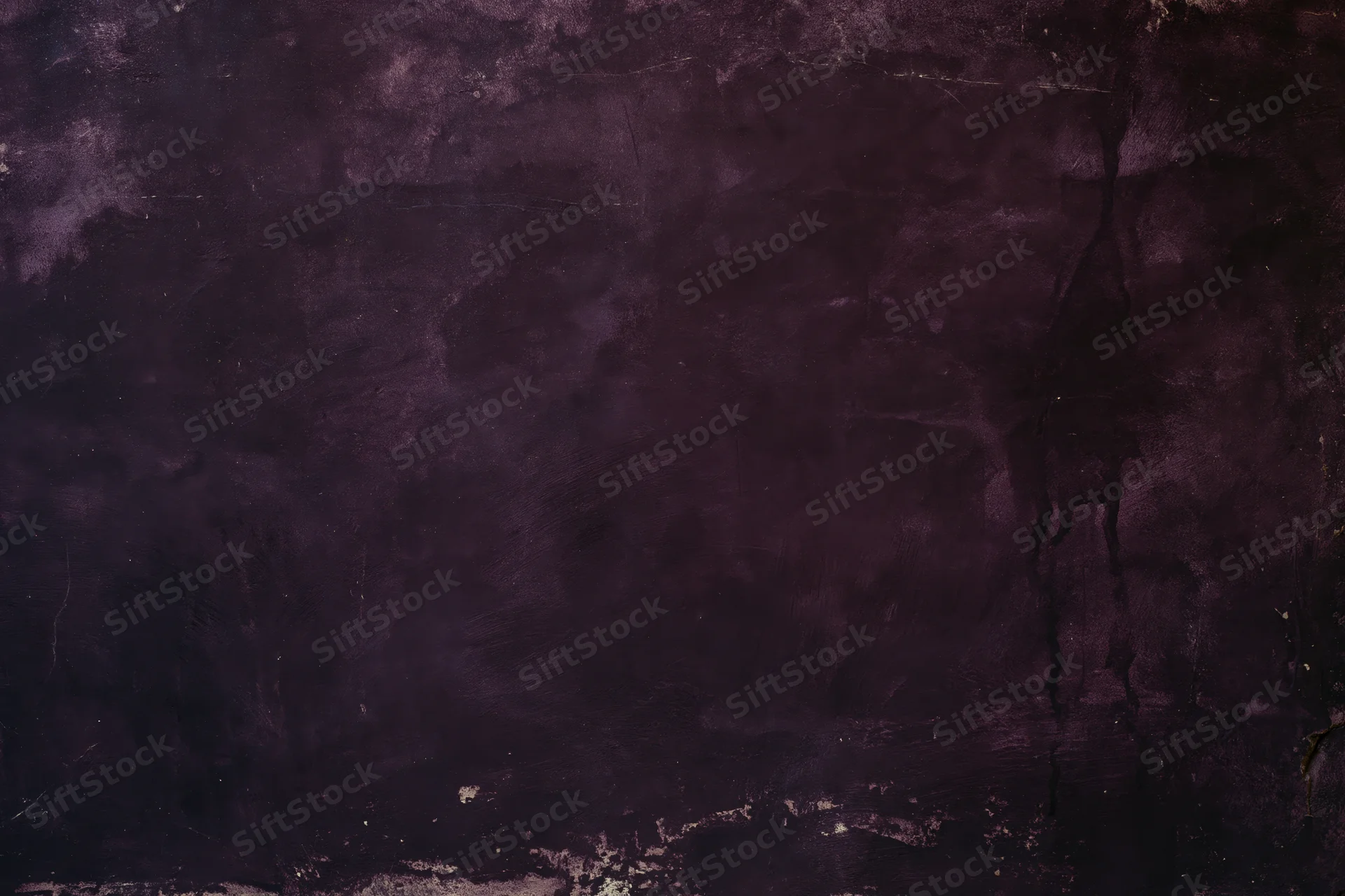 Weathered concrete wall surface filling the frame with cracks and discoloration