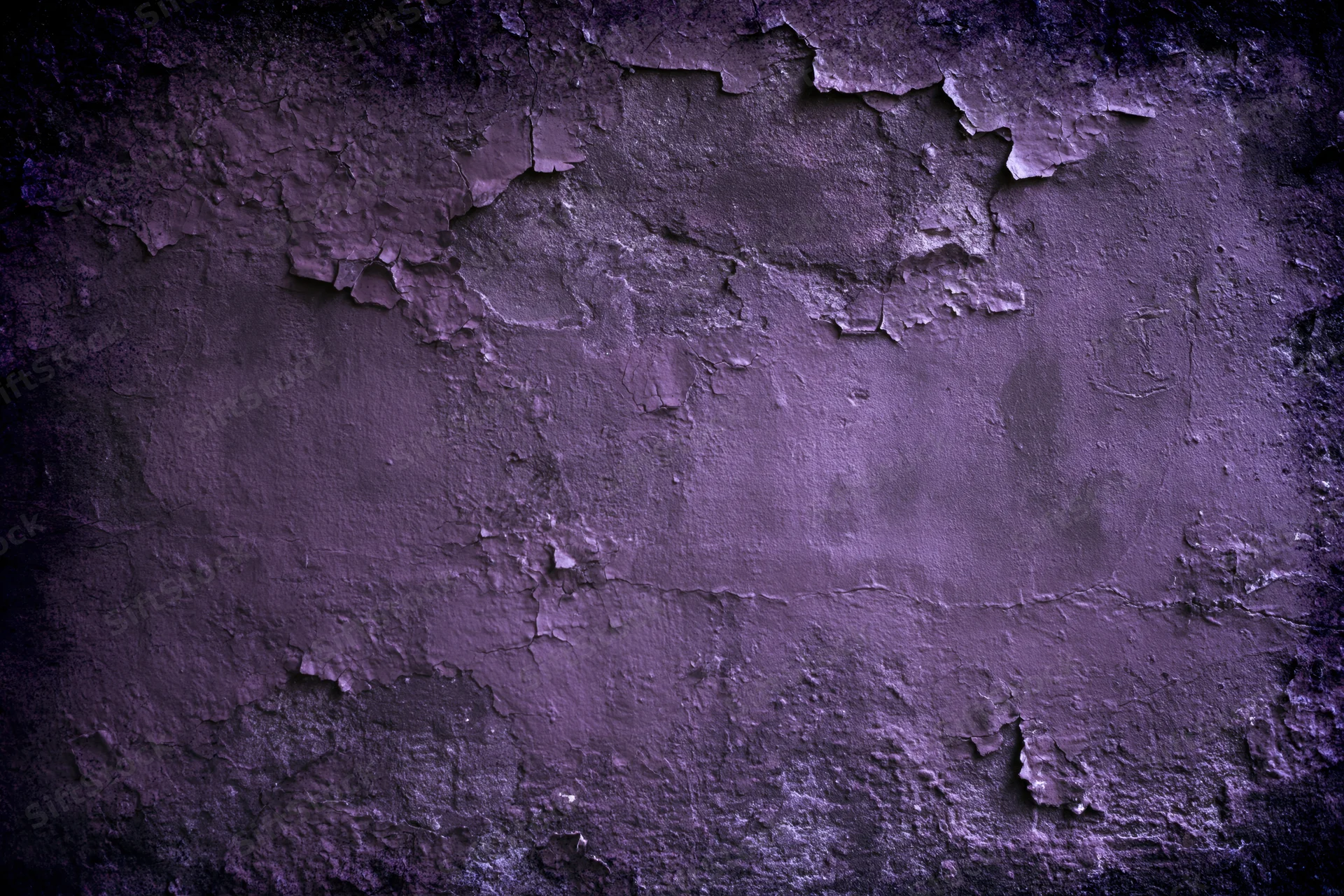 Weathered concrete wall with peeling paint and cracked texture in purple tones