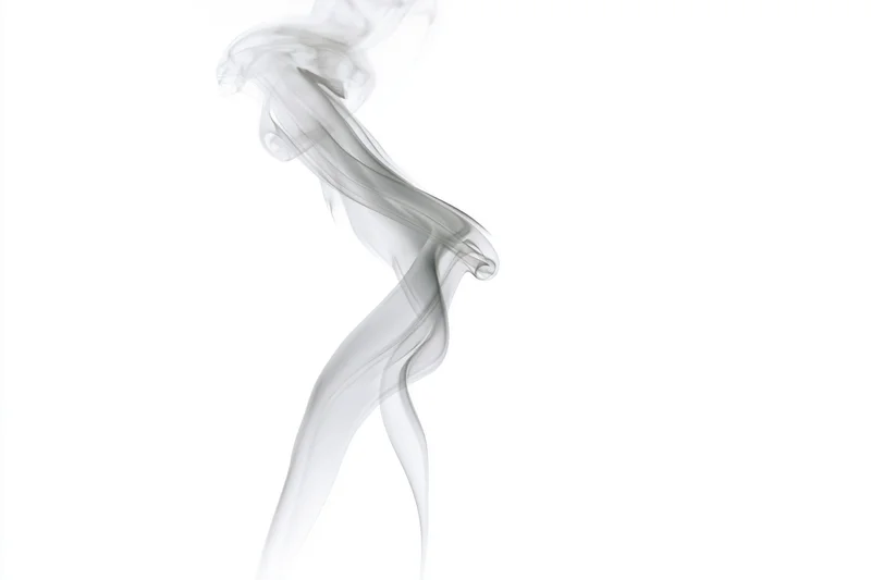 Wispy smoke plume rising and curling mid-air against white background