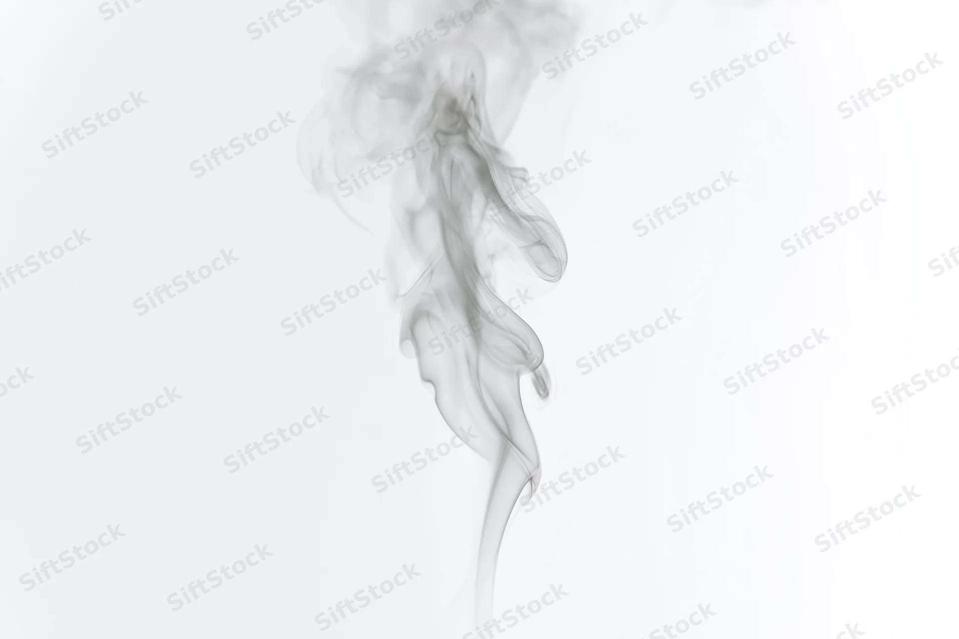 Wispy smoke plume rising and curling mid-air against a white background