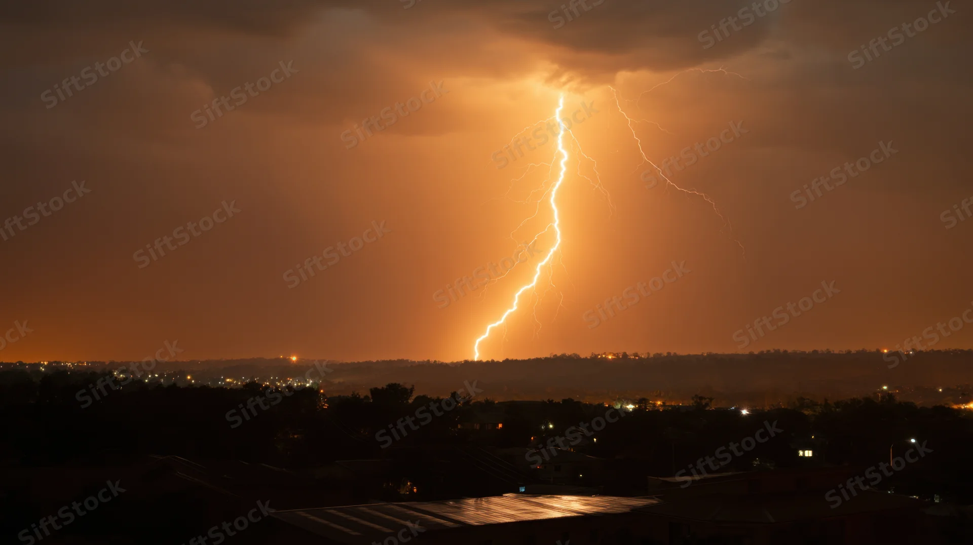 Jagged lightning bolt striking over a dark city skyline at night