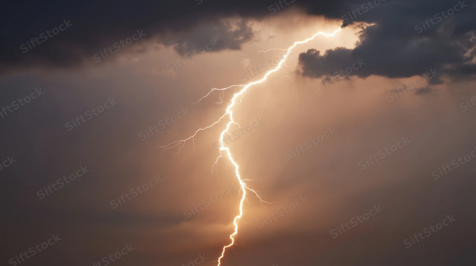 Lightning bolt striking through dark storm clouds in night sky