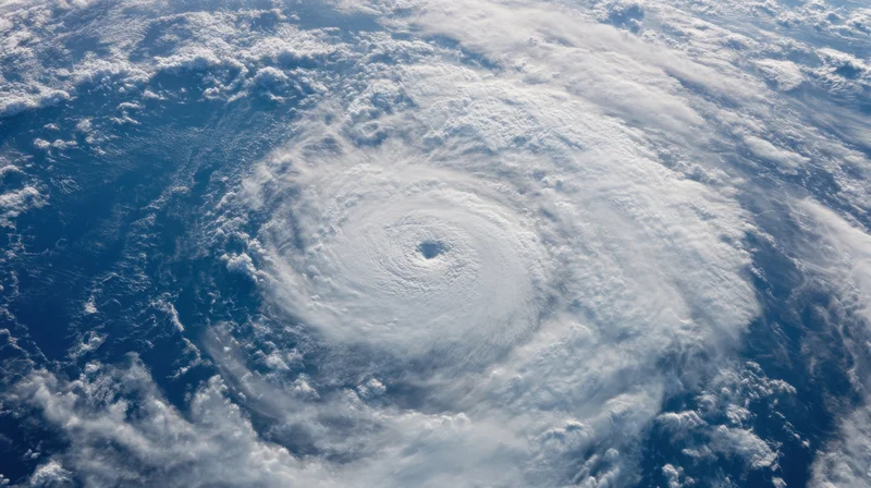 Satellite view of a hurricane with visible eye over ocean